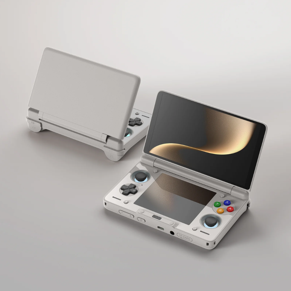 White handheld gaming console with a stylized screen on a light gray background