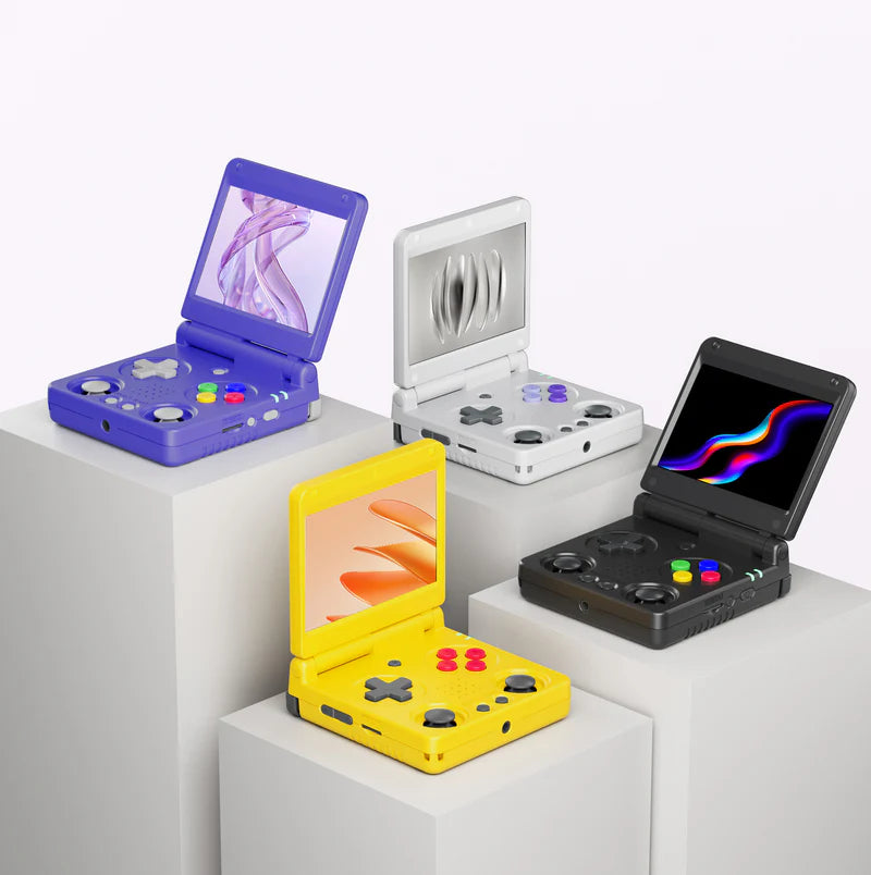 Four colorful portable gaming devices on a white surface with a light gray background