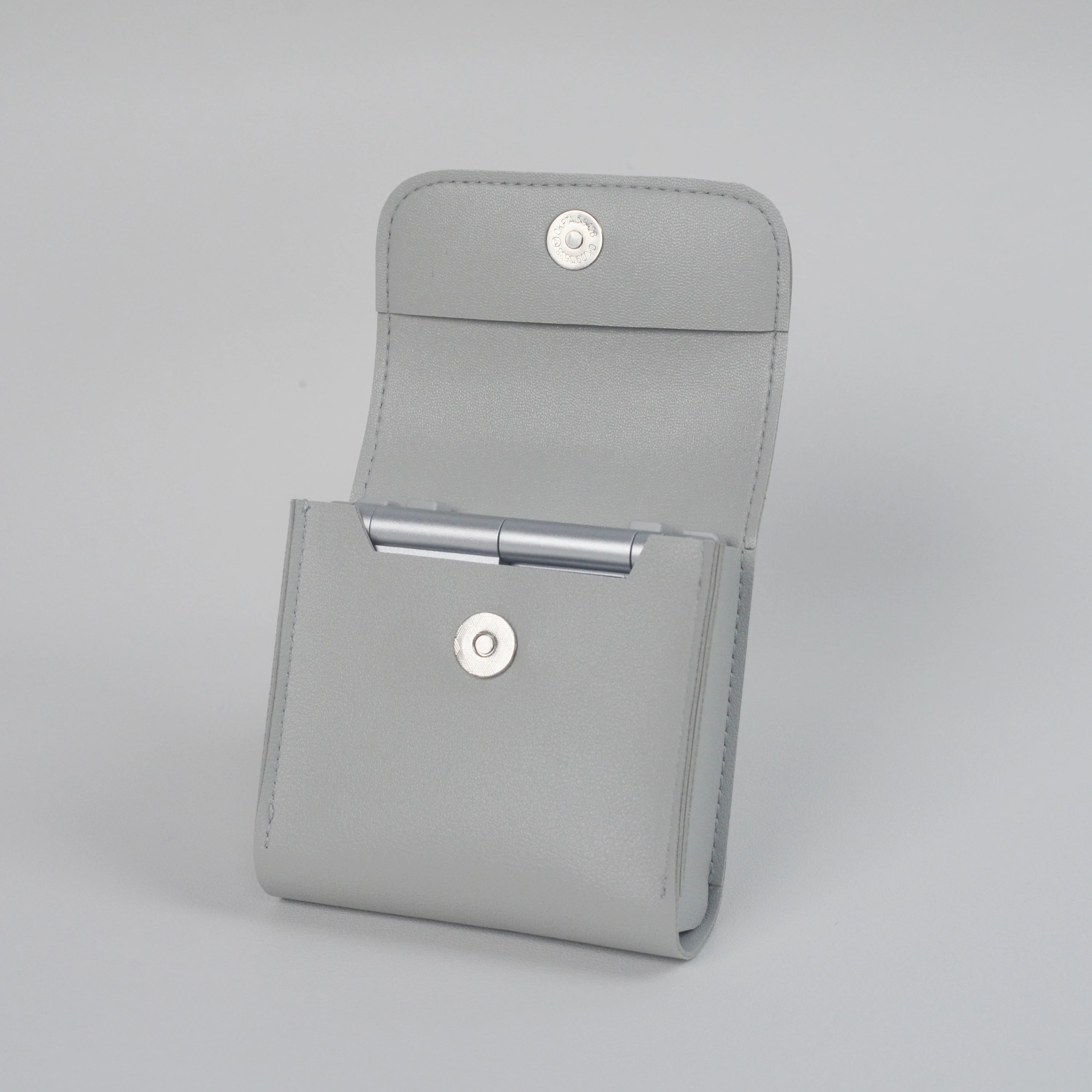 Gray case with metallic accents on a light gray background